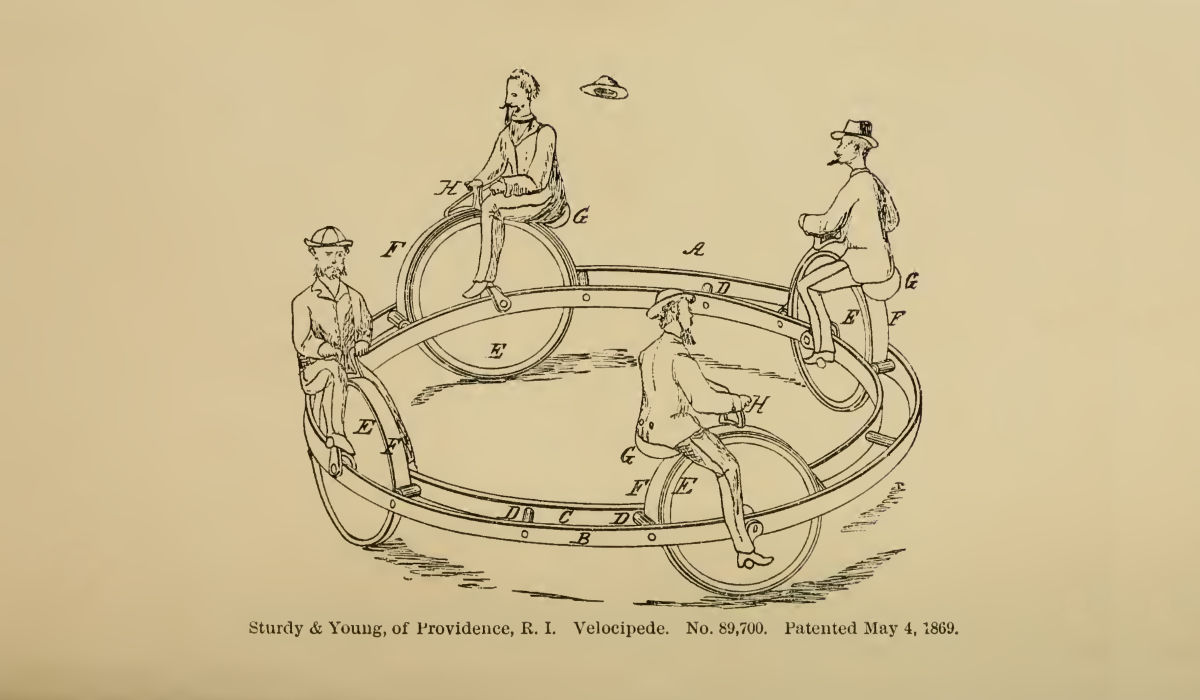 A patent illustration depicting four people positioned equidistant from each other around a large horizontal metal ring structure. Each person is sitting atop a wheel with pedals that's meant to run inside of the ring structure. One of the people has a hat that's blown off their head, presumably from the high speed they are travelling. The contraption has the appearance of something that would surely mangle all four people if this were ridden in real life.